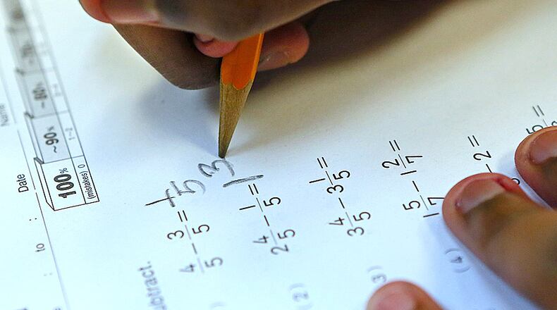 In Georgia, 59% of fourth graders scored at or above ‘basic’ in reading on the National Assessment of Educational Progress, which is consistent with the national average. Fourth grade math scores were a little better, with 75% scoring at or above basic, close to the national average of 76%. AJC FILE PHOTO.