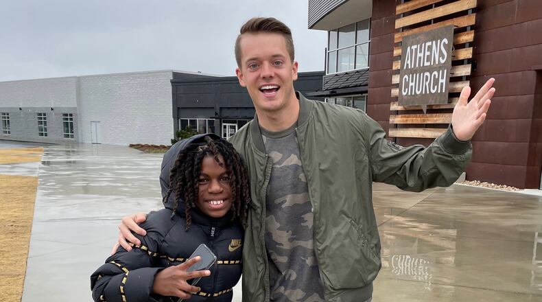 Zac Hendrix (R), a UGA graduate who has mentored Taeden Johnson since he was a third-grader, has come to Johnson's aid after he lost his family and most of his possessions in a fatal house fire in Athens on Jan. 27. (Photo by Zac Hendrix)