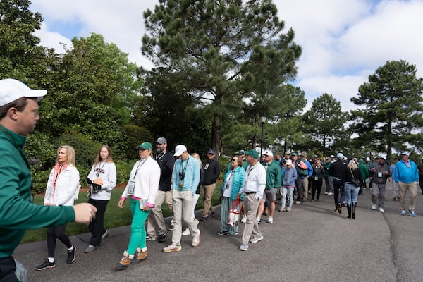 Patrons wait in line to get into the Golf Shop to purchase merchandise on the final day of the 2023 Masters Tournament at Augusta National Golf Club, Sunday, April 9 2023, in Augusta, Ga. (Michael A. Schwarz for the Atlanta Journal-Constitution)