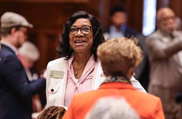 House Minority Leader Carolyn Hugley chats with legislators during the 2025 Georgia Legislative session. (Natrice Miller/AJC)