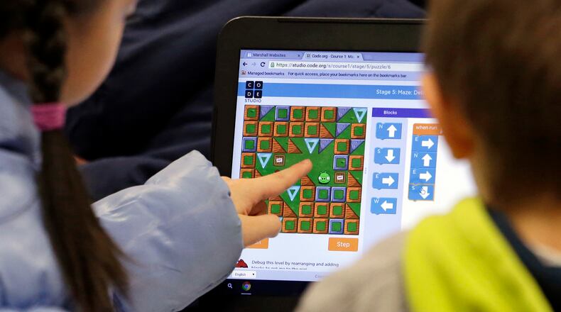 DeKalb plans to make up two days lost to weather with online learning. (AP Photo/Elaine Thompson)