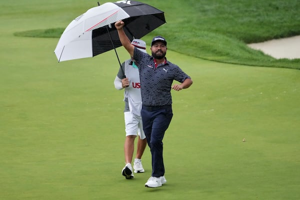 J.J. Spaun celebrates making a birdie putt on the 18th hole during the final round of the U.S. Open golf tournament at Oakmont Country Club Sunday, June 15, 2025, in Oakmont, Pa. (AP Photo/Gene J. Puskar)