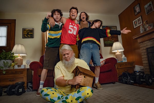 This image released by Netflix shows, background from left, Philip Schneider as Bobby, Maxwell Friedman as Gordie, Ethan Cutkosky as Wayne, Conor Sherry as Terry and John Daly as John Daly in "Happy Gilmore 2." (Scott Yamano/Netflix via AP)