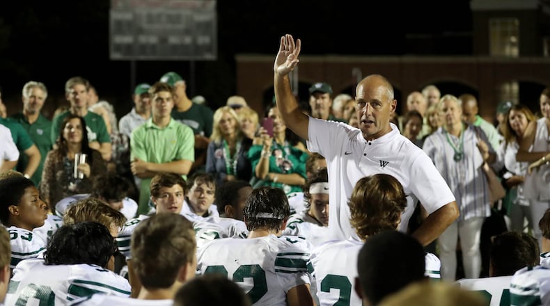 Westminster coach Gerry Romberg talks with his team after a win over GAC in Norcross. (Jason Getz/Special)