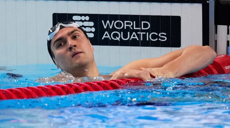 FILE - Neutral Athlete Russia, Kliment Kolesnikov reacts after winning gold medal in the men's 50-meter backstroke final at the World Aquatics Championships in Singapore, on Aug. 3, 2025. (AP Photo/Vincent Thian, File)
