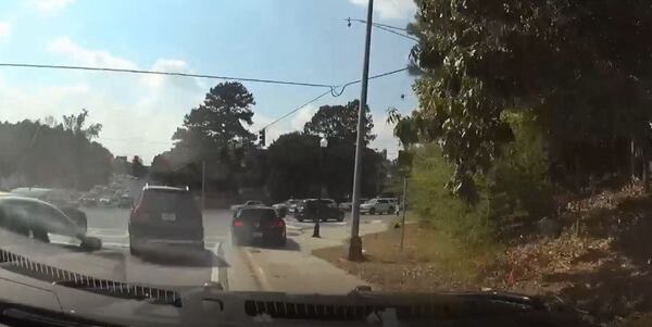 Police hopped a curb to follow the car onto Lenox Road.