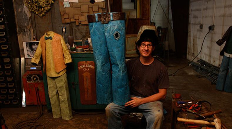 Dalton artist Chris Beck, shown with one of his sculptures in his studio, will be one of the many artists at Folk Fest, being held Aug. 15-17 at North Atlanta Trade Center in Norcross.