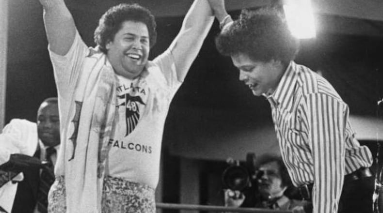 Atlanta Mayor Maynard Jackson "knocked out" Muhammad Ali in 1975, with then Georgia state Sen. Julian Bond officiating. AJC archives photo/Billy Downs