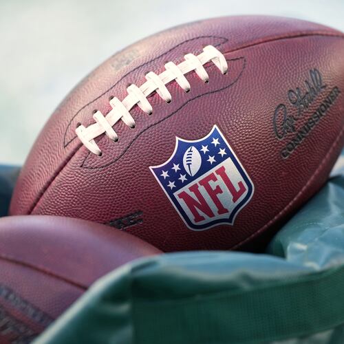 FILE - Footballs are seen before an NFL football game in Philadelphia on Jan. 4, 2026. (AP Photo/Matt Slocum, File)