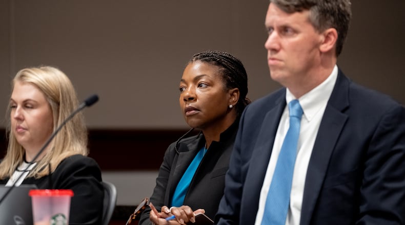 Cobb County Board of Elections Chairwoman Tori Silas (center) sits next to the board's attorney Daniel White (right) and Elections Director Tate Fall (left) in Cobb Superior Court on Thursday, June 20, 2024. (Ben Hendren for the Atlanta Journal-Constitution)