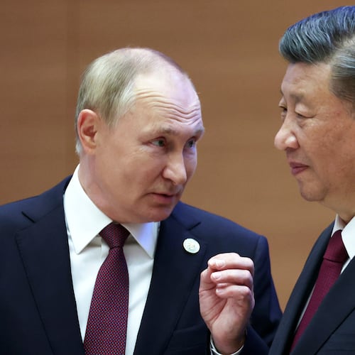 FILE - Russian President Vladimir Putin, left, gestures while speaking to Chinese President Xi Jinping during the Shanghai Cooperation Organization (SCO) summit in Samarkand, Uzbekistan, Sept. 16, 2022. (Sergei Bobylev, Sputnik, Kremlin Pool Photo via AP, File)