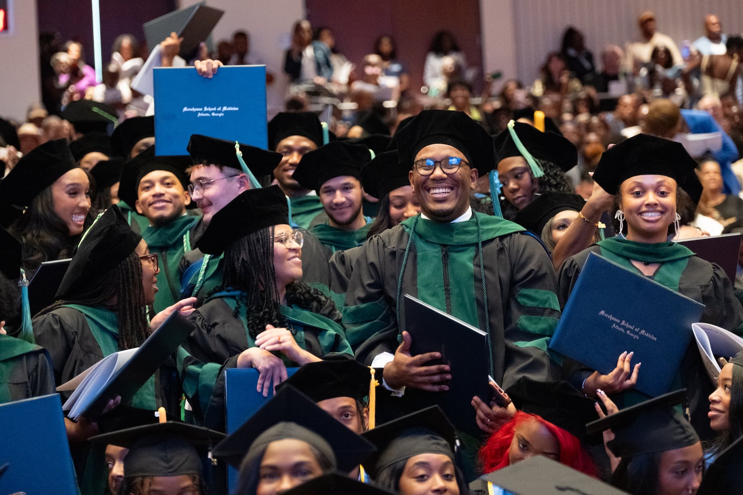 New medical doctors celebrate after receiving their degrees during the Morehouse School of Medicine graduation ceremony on Saturday, May 16, 2026, in Atlanta. (Ben Gray for the AJC)