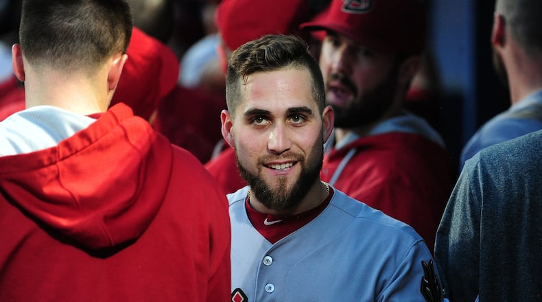 Ender Inciarte of the Arizona Diamondbacks is congratulated by teammates after scoring a run against the Braves at Turner Field on August 15, 2015. Now he'll be scoring runs for the Braves. (Photo by Scott Cunningham/Getty Images)