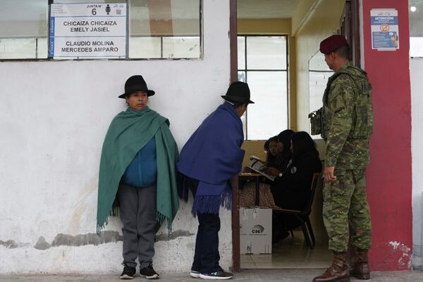 Women line up to vote in the presidential election runoff in Latacunga, Ecuador. Sunday, April 13, 2025. (AP Photo/Dolores Ochoa)