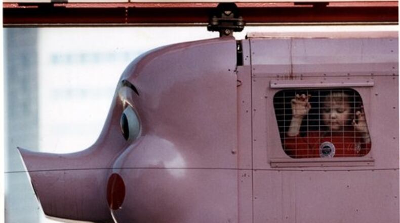 Generations of Georgians have ridden The Pink Pig, a holiday tradition that started at Rich's department store in 1953. This photo was taken in 1990.
