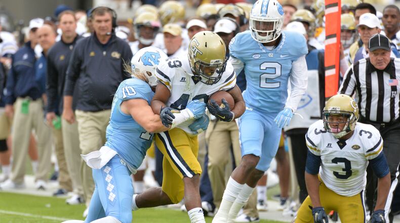 October 3, 2015 Atlanta - Georgia Tech Yellow Jackets running back Clinton Lynch (49) eludes a tackle by North Carolina Tar Heels linebacker Jeff Schoettmer (10) in the first half at Bobby Dodd Stadium on Saturday, October 3, 2015. HYOSUB SHIN / HSHIN@AJC.COM