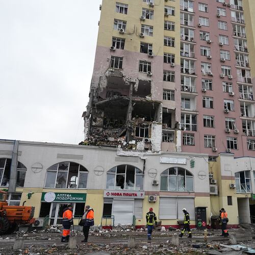 Rescuers work on the scene of a building damaged by a Russian attack in Kyiv, Ukraine, Saturday, Dec. 27, 2025. (AP Photo/Efrem Lukatsky)