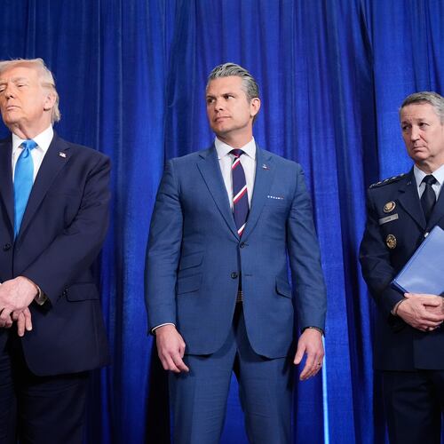 President Donald Trump, Defense Secretary Pete Hegseth and Chairman of the Joint Chiefs of Staff Gen. Dan Caine listen as Secretary of State Marco Rubio speaks during a news conference at Mar-a-Lago, Saturday, Jan. 3, 2026, in Palm Beach, Fla. (AP Photo/Alex Brandon)