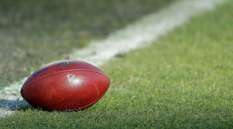 Football with the Atlanta Falcons' logo on it sits on the field prior to an NFL divisional playoff football game against the Philadelphia Eagles, Saturday, Jan. 13, 2018, in Philadelphia. Philadelphia won 15-10. (Photo by Chris Szagola)