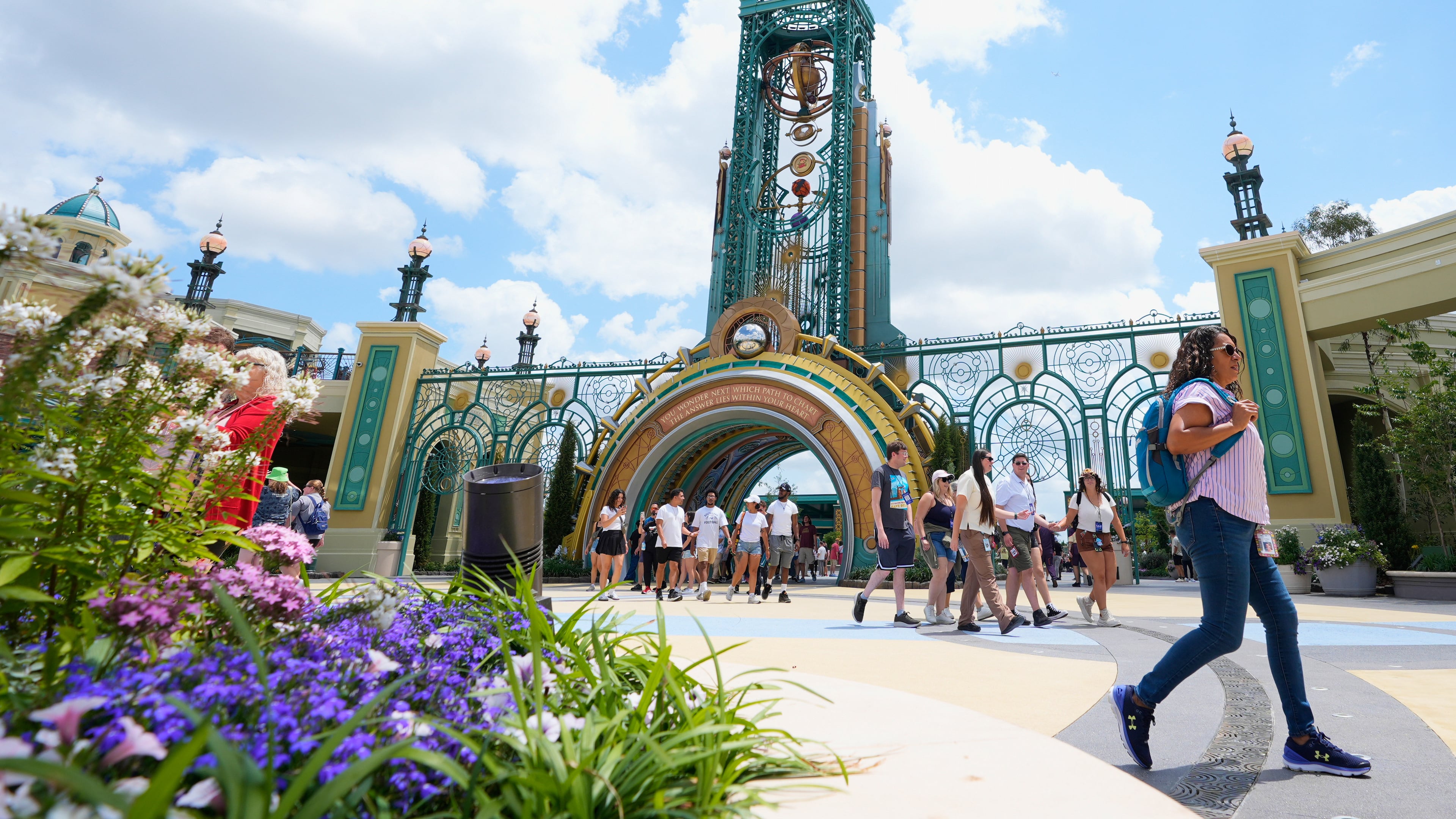 FILE - Guests arrive at the main entrance to Epic Universe Theme Park at Universal Resort Orlando, April 10, 2025, in Orlando, Fla. (AP Photo/John Raoux, File)