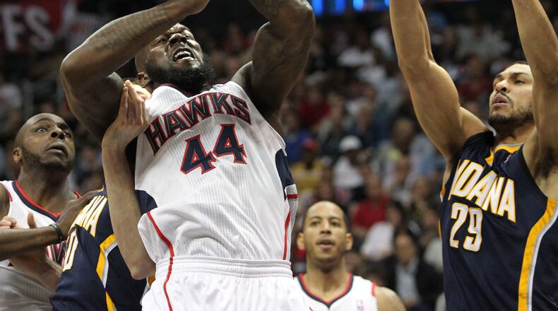 Hawks forward Ivan Johnson wins the rebound battle with Pacers forward Jeff Pendergraph during the first half of their NBA playoff game with Indiana on Saturday, April 27, 2013, in Atlanta.