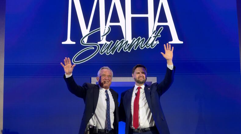 Vice President JD Vance, right, and Health and Human Services Secretary Robert F. Kennedy, Jr., wave as they depart the inaugural Make America Healthy Again summit at the Waldorf Astoria, Wednesday, Nov. 12, 2025, in Washington. (AP Photo/Rod Lamkey, Jr.)