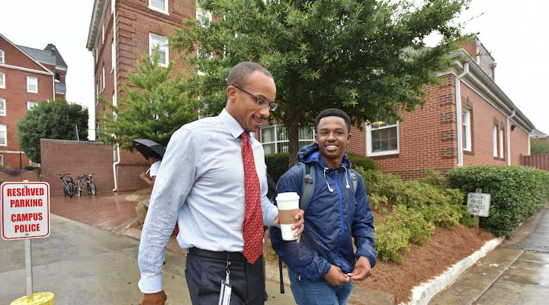 Morehouse College interim president Harold Martin chats with student Solomon Enders as they walk to the school cafeteria at Morehouse College on Wednesday, Aug. 30, 2017. Morehouse continues its search for a full-time president. The job could go to Martin, who’s father is also president of a HBCU. HYOSUB SHIN / HSHIN@AJC.COM