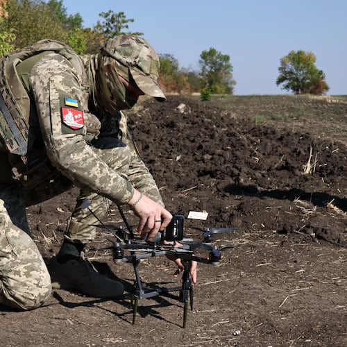 In this photo provided by Ukraine's 65th Mechanized Brigade press service, a Ukrainian soldier prepares an FPV drone to fire towards Russian positions in Zaporizhzhia region, Ukraine, Saturday, Sept. 19, 2026. (Andriy Andriyenko/Ukraine's 65th Mechanized Brigade via AP)