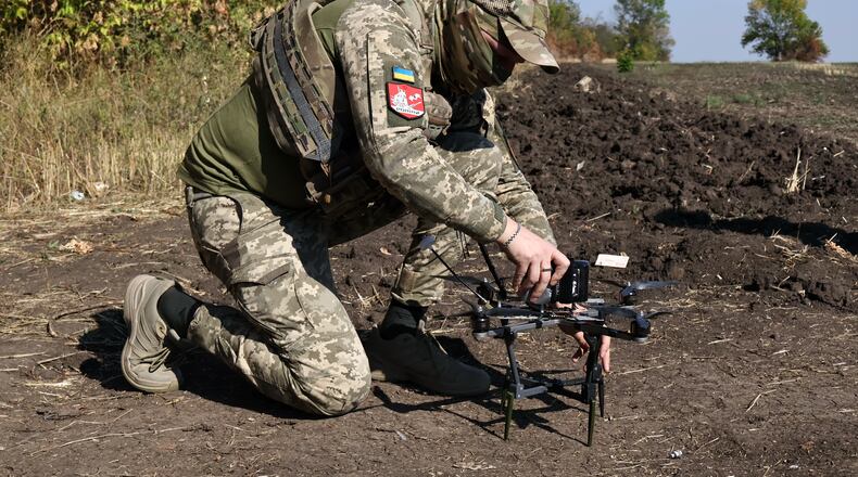 In this photo provided by Ukraine's 65th Mechanized Brigade press service, a Ukrainian soldier prepares an FPV drone to fire towards Russian positions in Zaporizhzhia region, Ukraine, Saturday, Sept. 19, 2026. (Andriy Andriyenko/Ukraine's 65th Mechanized Brigade via AP)