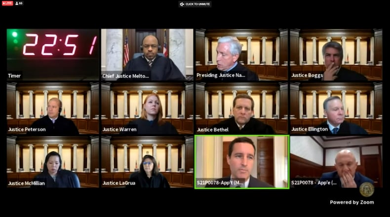 The Georgia Supreme Court hears arguments Tuesday in Rodney Young's death-penalty appeal. Top row from left to right: Chief Justice Harold Melton and Justices David Nahmias and Michael Boggs. Middle row: Justices Nels Peterson, Sarah Warren, Charles Bethel and John Ellington. Bottom row: Justices Carla Wong McMillian and Shawn LaGrua, Josh Moore of the state capital defender office and Newton County District Attorney Randy McGinley. (Pete Corson/AJC)
