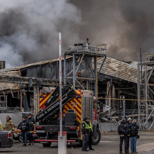 Smoke bellows from a warehouse that caught fire following a Russian attack, Saturday, Oct. 25, 2025, in Kyiv, Ukraine. (AP Photo/Julia Demaree Nikhinson)