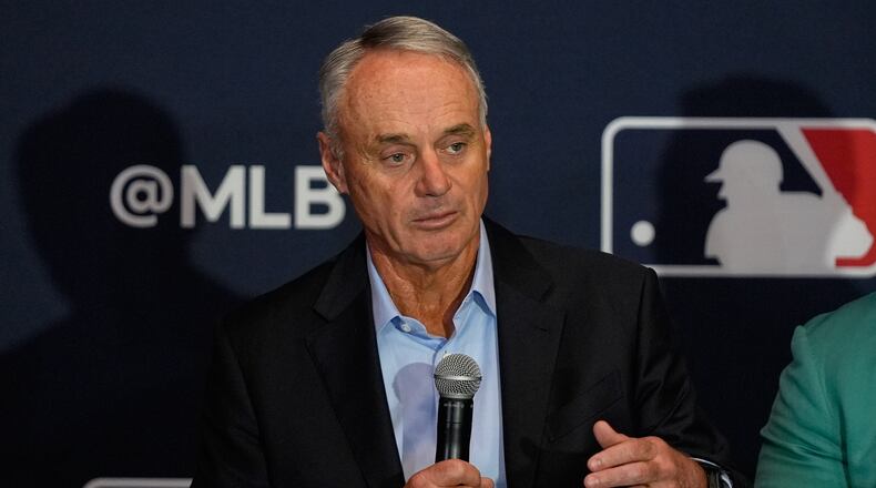 FILE - Rob Manfred, commissioner of Major League Baseball answers questions during a news conference at the MLB winter meetings, Dec. 8, 2025, in Orlando, Fla. (AP Photo/John Raoux, file)