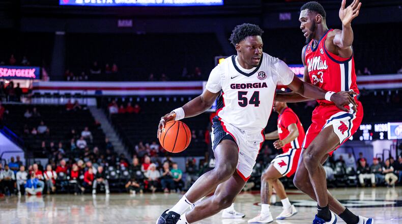 Georgia center Russel Tchewa drives against Ole Miss at Stegeman Coliseum on Tuesday, Mar. 5, 2024. (Cassie Baker/UGAAA)