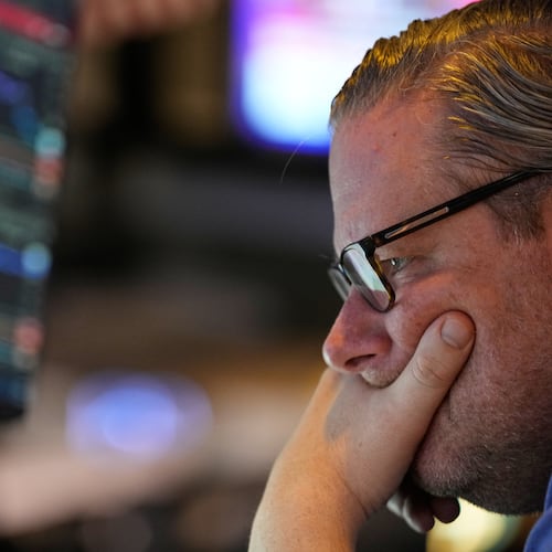Gregg Maloney works on the floor at the New York Stock Exchange in New York, Wednesday, Dec. 10, 2025. (AP Photo/Seth Wenig)