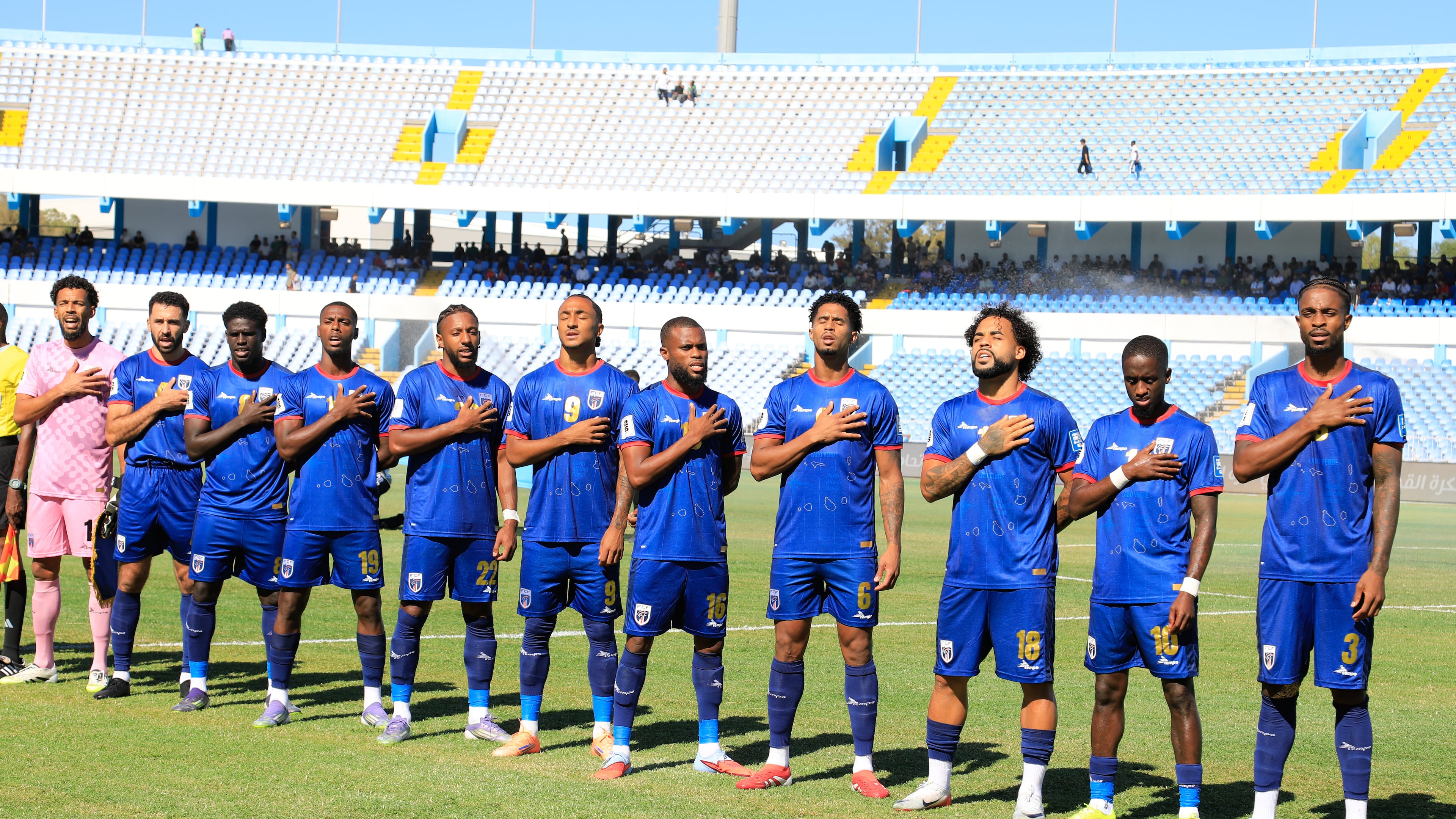 Cape Verde players stand for the national anthem during the World Cup 2026 African qualifier Group D soccer match between Libya and Cape Verde in Tripoli, Libya, Wednesday, Oct. 8, 2025. (AP Photo/Yousef Murad)
