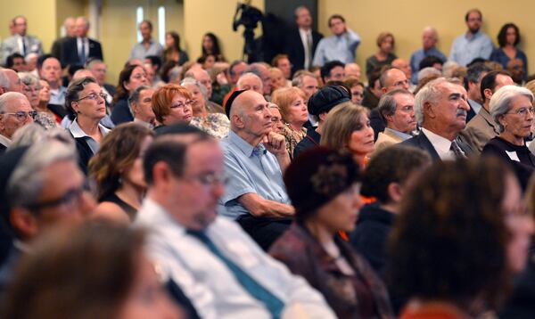 Hundreds audience members listen to panelists after Film premiere documenting the period 1948 -1961, when an abnormally high rate of failure for Jewish dental students at Emory pointed to a culture of anti-Semitism.