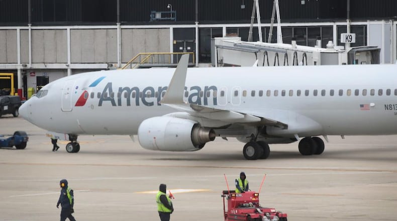A baggage handler told police he was drunk when he fell asleep in a American Airlines plane's cargo hold.