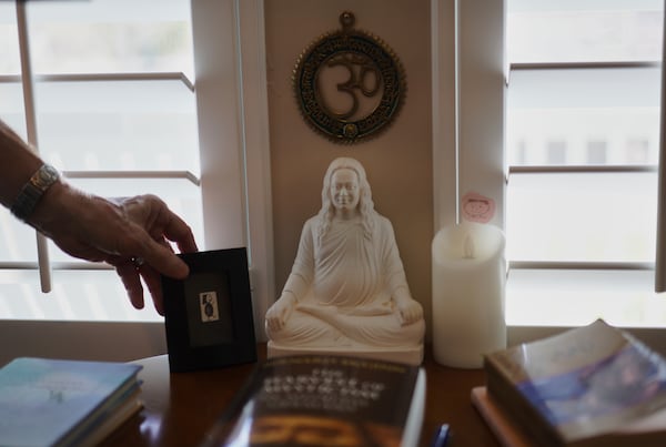 Objects reflecting Philip McLemore's yoga practice sit in his office at his home in Eagle Mountain, Utah, on Thursday, April 24, 2025. (AP Photo/Jessie Wardarski)