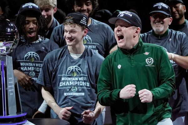 Colorado State head coach Niko Medved celebrates after cutting down the net after his team defeated Boise State in an NCAA college basketball championship game at the Mountain West Conference tournament Saturday, March 15, 2025, in Las Vegas. (AP Photo/John Locher)