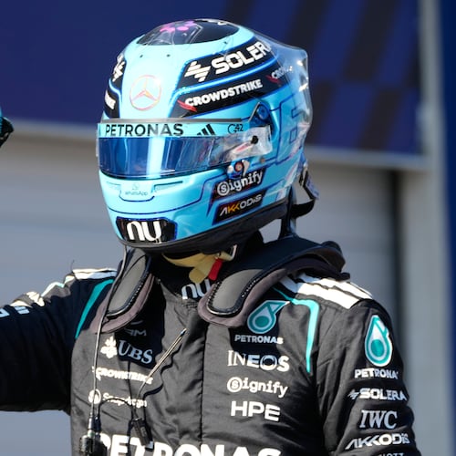 Mercedes driver George Russell of Britain celebrates after setting the pole position during the qualifying session ahead of the Austrian F1 Grand Prix, in Spielberg, Austria, Saturday, June 27, 2026. (AP Photo/Darko Bandic)