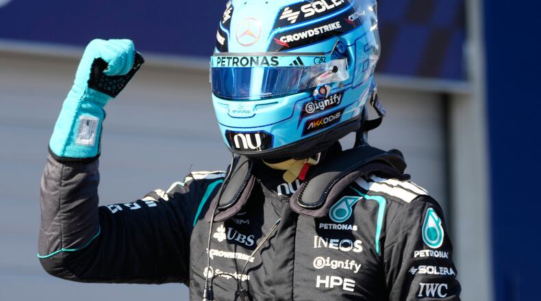 Mercedes driver George Russell of Britain celebrates after setting the pole position during the qualifying session ahead of the Austrian F1 Grand Prix, in Spielberg, Austria, Saturday, June 27, 2026. (AP Photo/Darko Bandic)