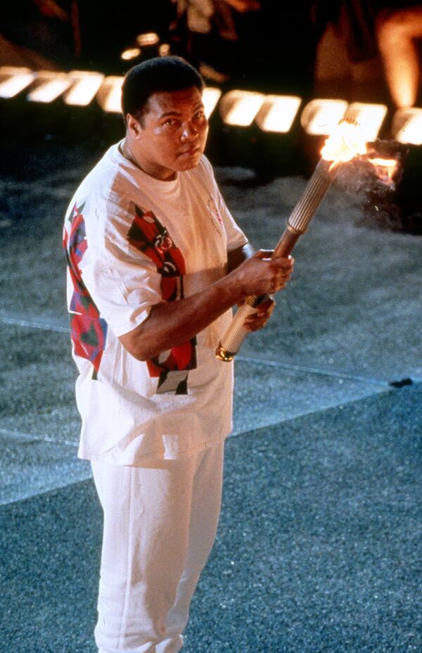 Muhammad Ali prepares to light the Olympic caldron, 1996. (Allen Eyestone/Cox News Service 1996)