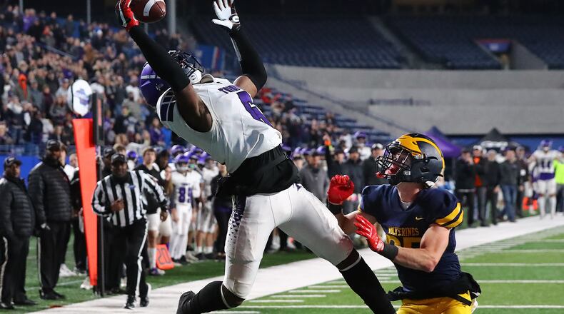 Trinity Christian wide receiver Aaron Gates goes up for a one-handed touchdown catch in 2021. (Curtis Compton / Curtis.Compton@ajc.com)