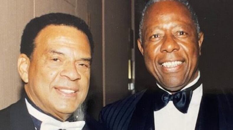Among the most notable Black Atlantans who have made their mark in history are the Rev. Andrew Young (left), now 88, and the late Hank Aaron, baseball's best, who attended a past Mayor's Masked Ball. (Courtesy of UNCF)