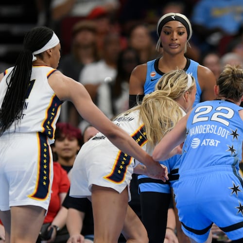 Chicago Sky's DiJonai Carrington, back, stares down Indiana Fever's Sophie Cunningham (8) after committing a flagrant foul against Cunningham and before she was ejected from the game during the first half of an WNBA basketball game in Chicago, Saturday, Aug. 8, 2026. (AP Photo/Paul Beaty)