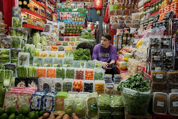 A shopkeeper waits for customers at Tajrish traditional bazaar in northern Tehran, Iran, Friday, June 13, 2025. (AP Photo/Vahid Salemi)