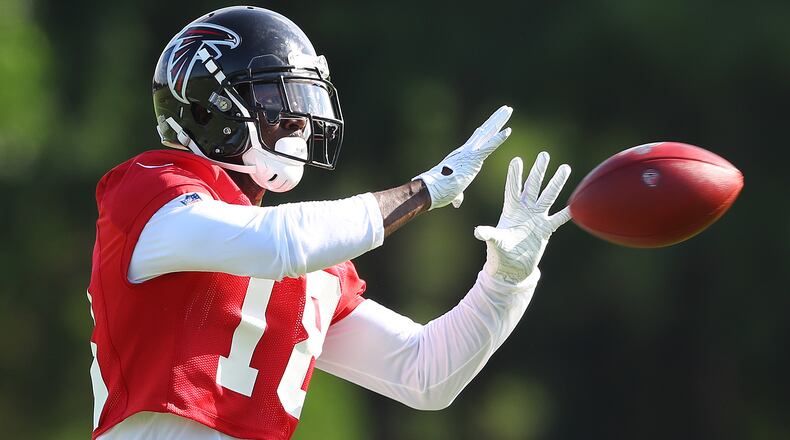 Falcons wide receiver Calvin Ridley catches a pas from Matt Ryan during the first practice of training camp Monday, July 22, 2019, in Flowery Branch.