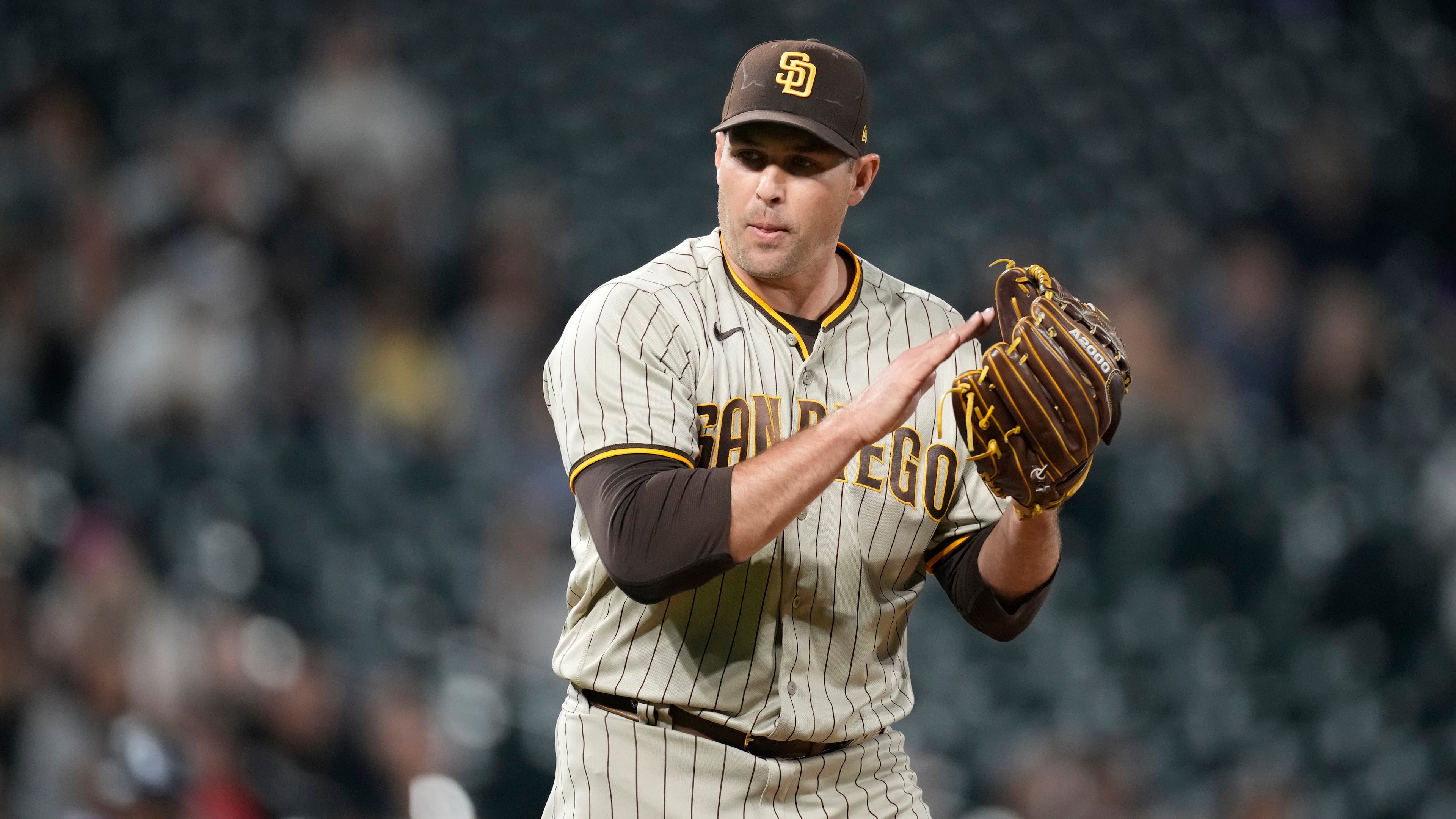 FILE - San Diego Padres relief pitcher Craig Stammen reacts after getting Colorado Rockies' Brian Serven to ground out to end the ninth inning of a baseball game Saturday, Sept. 24, 2022, in Denver. (AP Photo/David Zalubowski, File)