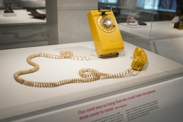 A rotary phone is part of a collection of objects that tell stories about peoples' lives in public housing at the National Public Housing Museum, built in the last remaining building of the 1930s WPA-era Jane Addams Homes, Wednesday, March 19, 2025, in Chicago. (AP Photo/Erin Hooley)