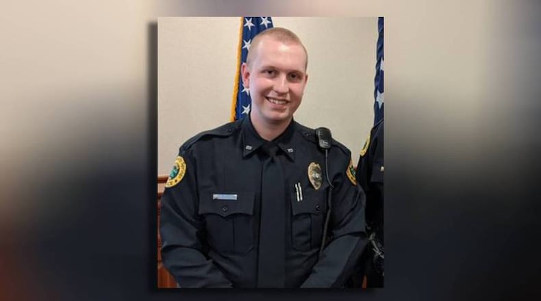 Holly Springs Officer Joe Burson was killed last year while being dragged by a vehicle following a traffic stop. Federal authorities were seeking to apprehend the driver, Ansy Dolce, when the convicted robber fled Burson and another officer, according to Georgia Bureau of Investigation records.